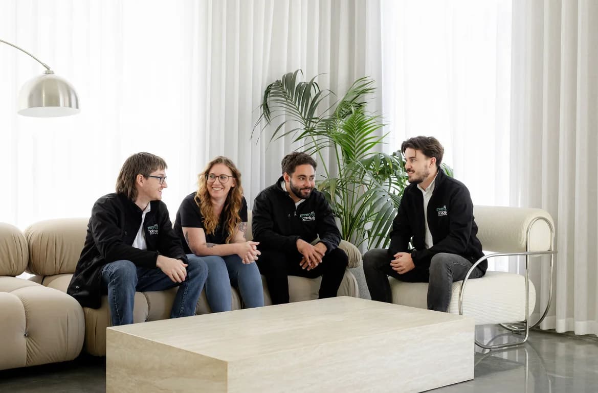 The Green Choice Consulting team talking together in the office
