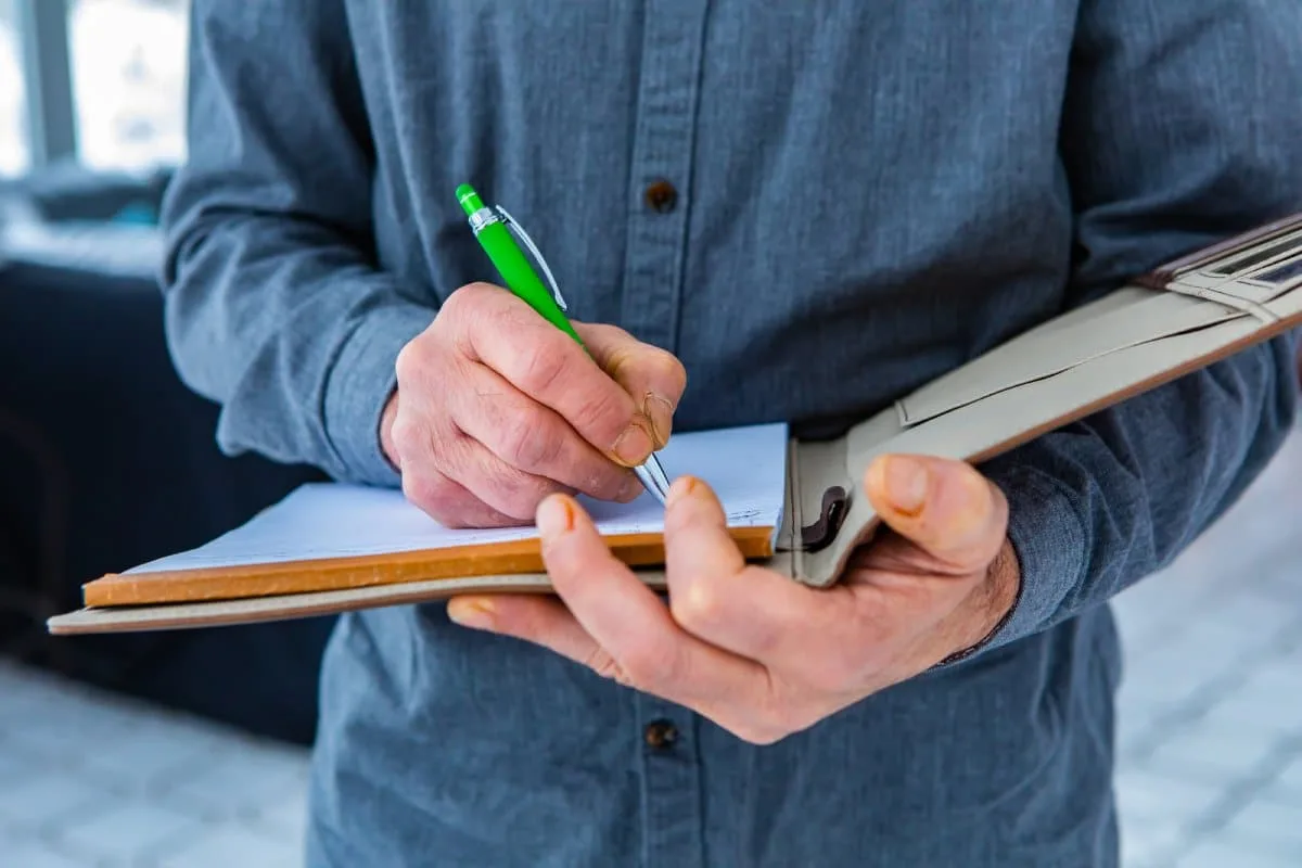 Assessor conducting a home energy assessment